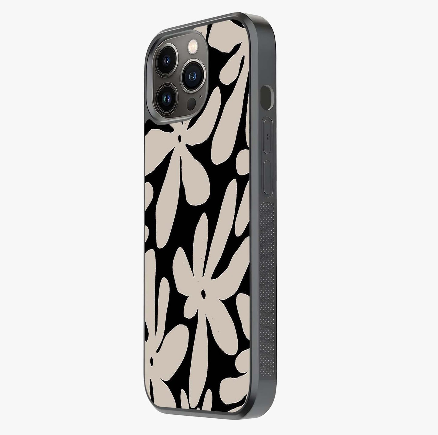Monochrome Petal Dance Glass Case photographed in natural light showing reflective finish and design depth.