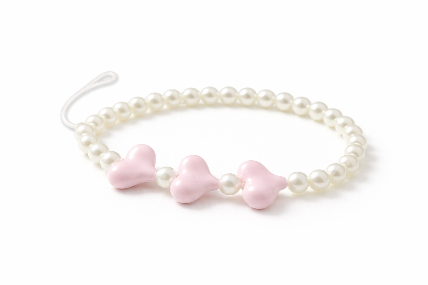 Pearl bracelet with pink bow-shaped beads on a white background