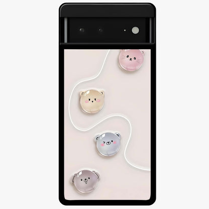 Puffy Face Parade Glass Case showing flat back view with cute puffy character faces artwork and glossy glass finish.
