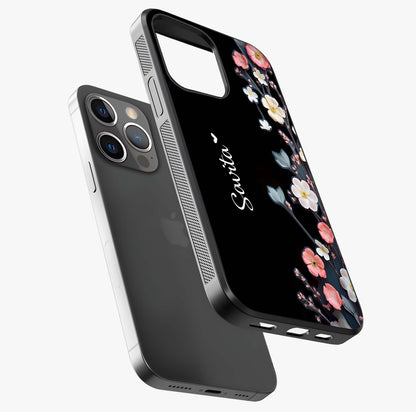 Black Elegance Floral Custom Name Glass Case laid diagonally highlighting side profile, edges and glossy glass shine.