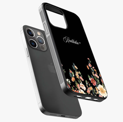 Floral Design With A Custom Personalized Name Glass Case laid diagonally highlighting side profile, edges and glossy glass shine.