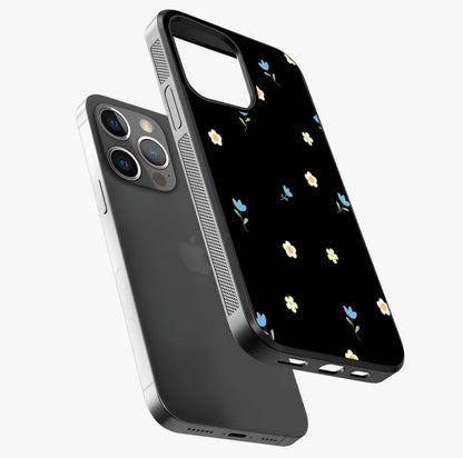 Minimalistic Blue With White Flower Pattern Glass Case laid diagonally highlighting side profile, edges and glossy glass shine.