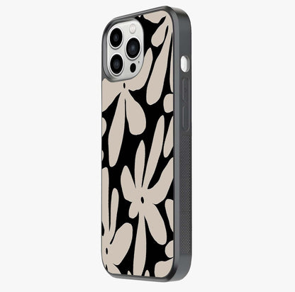 Monochrome Petal Dance Glass Case photographed in natural light showing reflective finish and design depth.