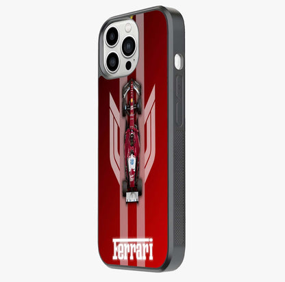 Red Ferrari F1 Vertical Glass Case photographed in natural light showing reflective finish and design depth.