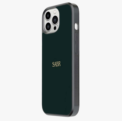 Sabr Minimal Patience Glass Case photographed in natural light showing reflective finish and design depth.