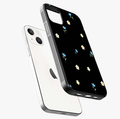 Minimalistic Blue With White Flower Pattern Glass Case laid diagonally highlighting side profile, edges and glossy glass shine.