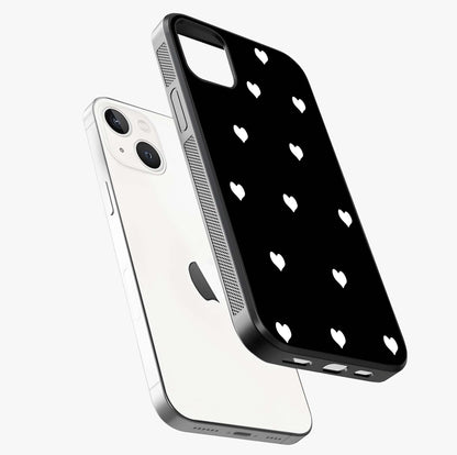 Cute And Simple White Hearts Glass Case laid diagonally highlighting side profile, edges and glossy glass shine.
