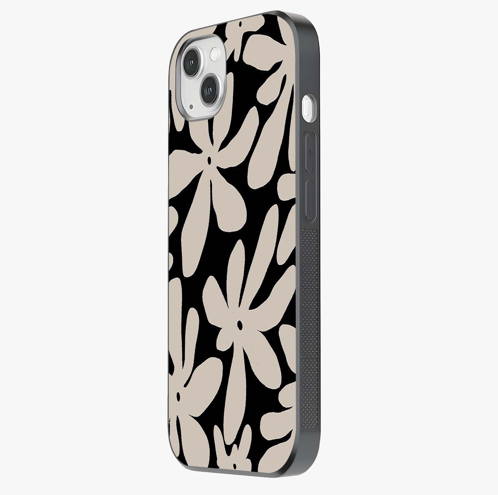 Monochrome Petal Dance Glass Case photographed in natural light showing reflective finish and design depth.
