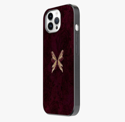 Crimson Fade Butterfly Glass Case photographed in natural light showing reflective finish and design depth.