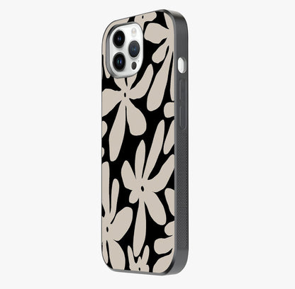 Monochrome Petal Dance Glass Case photographed in natural light showing reflective finish and design depth.