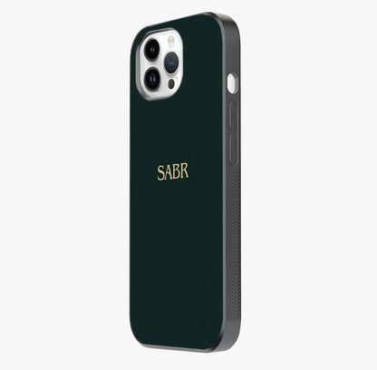Sabr Minimal Patience Glass Case photographed in natural light showing reflective finish and design depth.