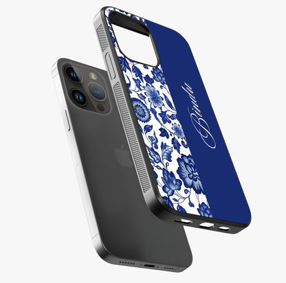 Blue Vintage Floral Pattern Glass Case laid diagonally highlighting side profile, edges and glossy glass shine.