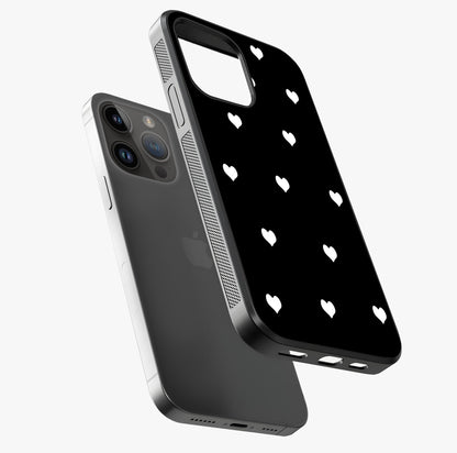 Cute And Simple White Hearts Glass Case laid diagonally highlighting side profile, edges and glossy glass shine.