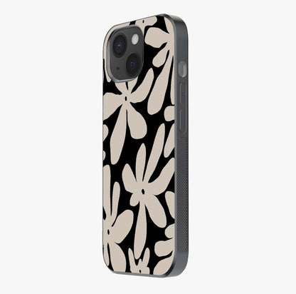 Monochrome Petal Dance Glass Case photographed in natural light showing reflective finish and design depth.