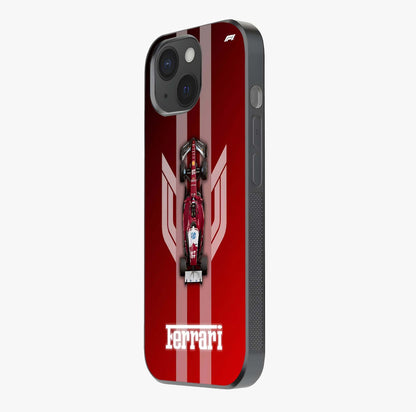 Red Ferrari F1 Vertical Glass Case photographed in natural light showing reflective finish and design depth.