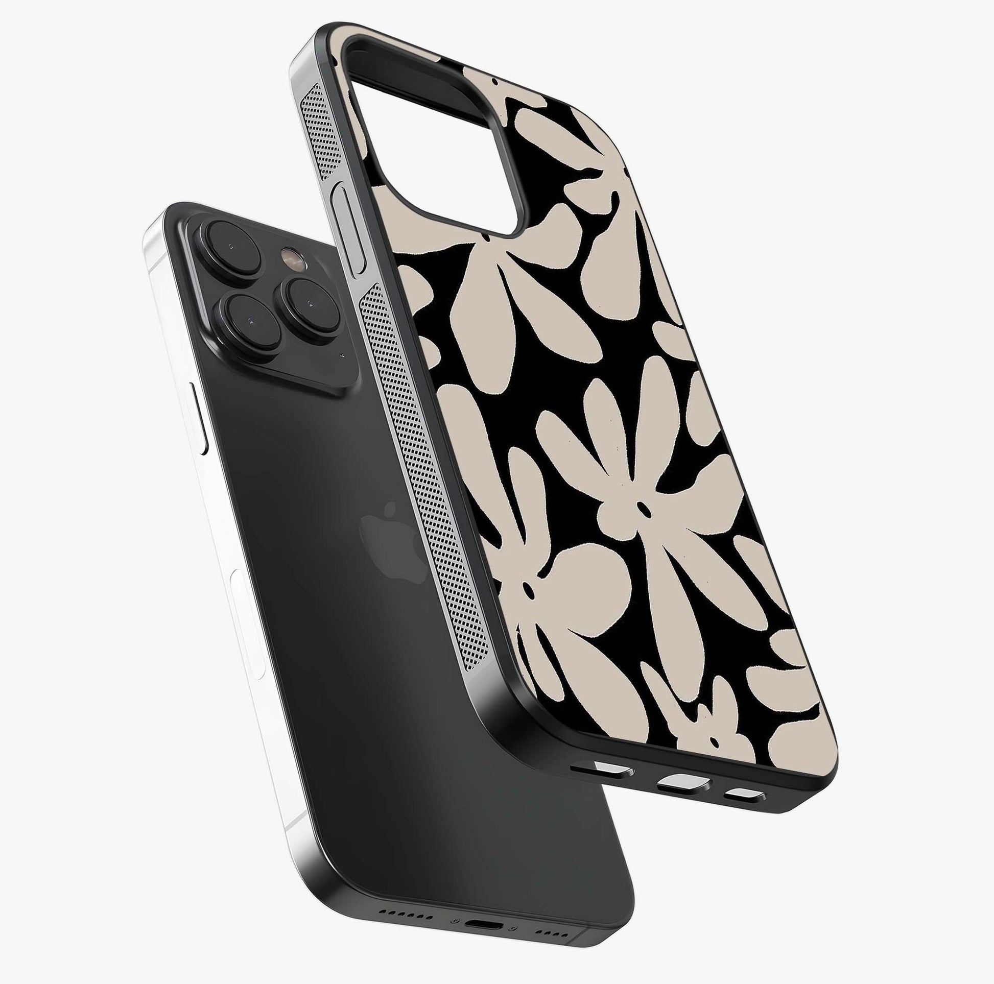 Monochrome Petal Dance Glass Case photographed in natural light showing reflective finish and design depth.
