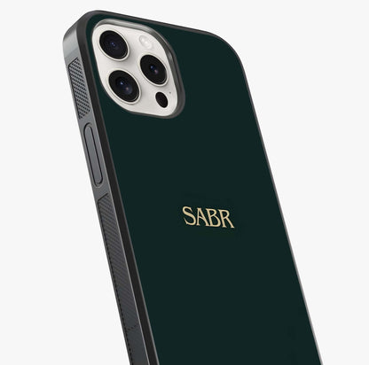 Sabr Minimal Patience Glass Case captured at a warm angle highlighting gloss, texture and premium glass finish.