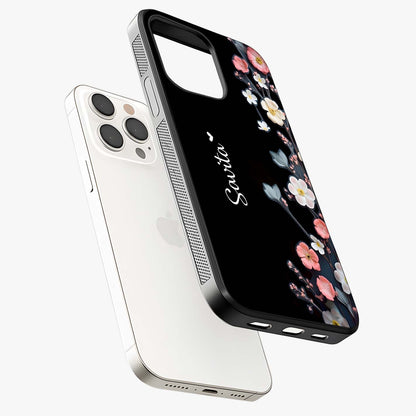 Black Elegance Floral Custom Name Glass Case laid diagonally highlighting side profile, edges and glossy glass shine.