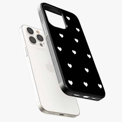 Cute And Simple White Hearts Glass Case laid diagonally highlighting side profile, edges and glossy glass shine.