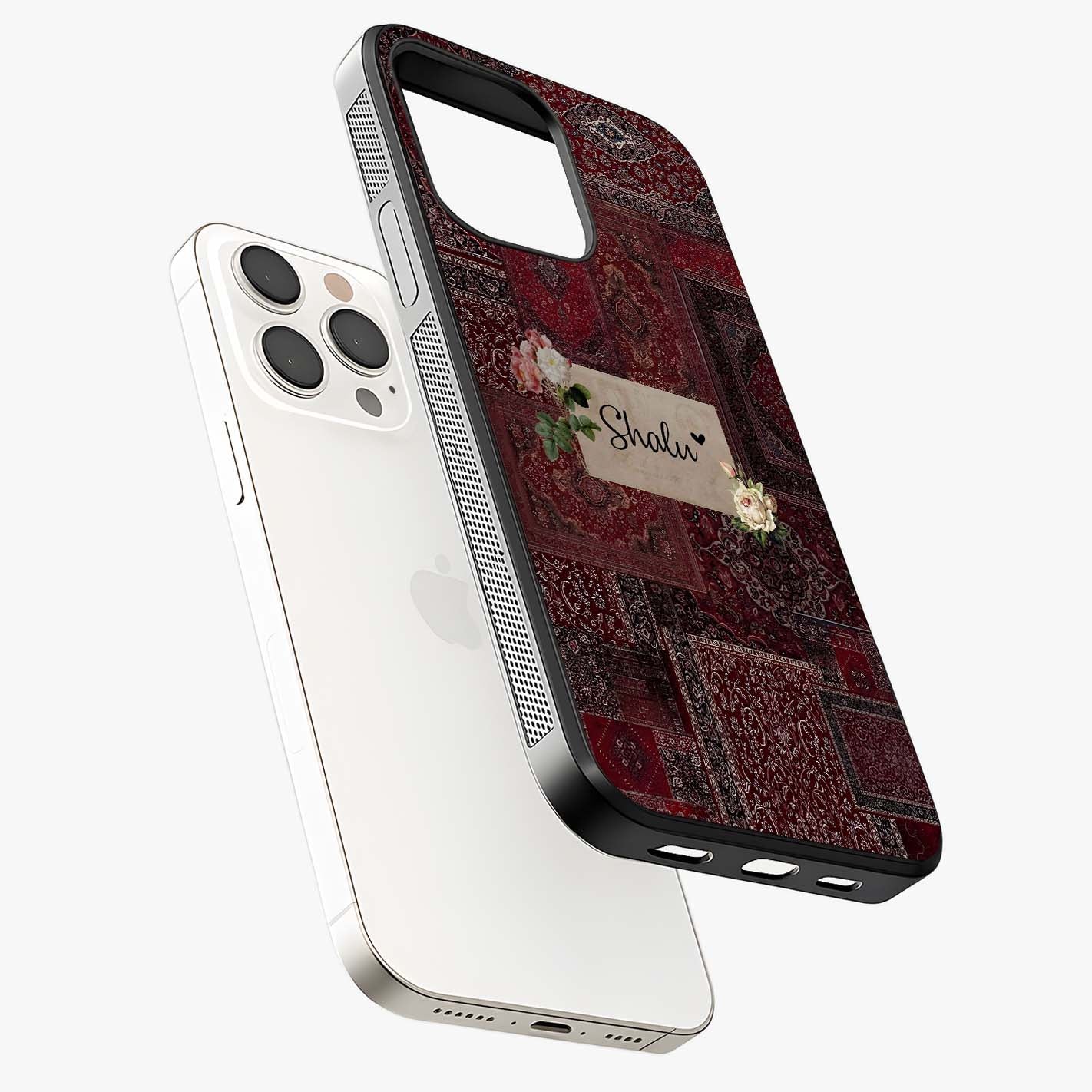 Velvet Wine Pattern Custom Name Glass Case laid diagonally highlighting side profile, edges and glossy glass shine.