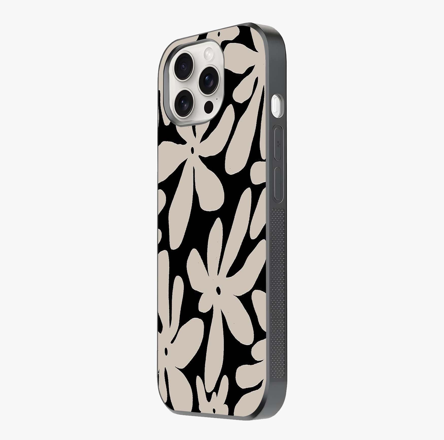Monochrome Petal Dance Glass Case photographed in natural light showing reflective finish and design depth.