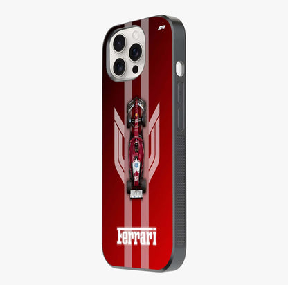 Red Ferrari F1 Vertical Glass Case photographed in natural light showing reflective finish and design depth.