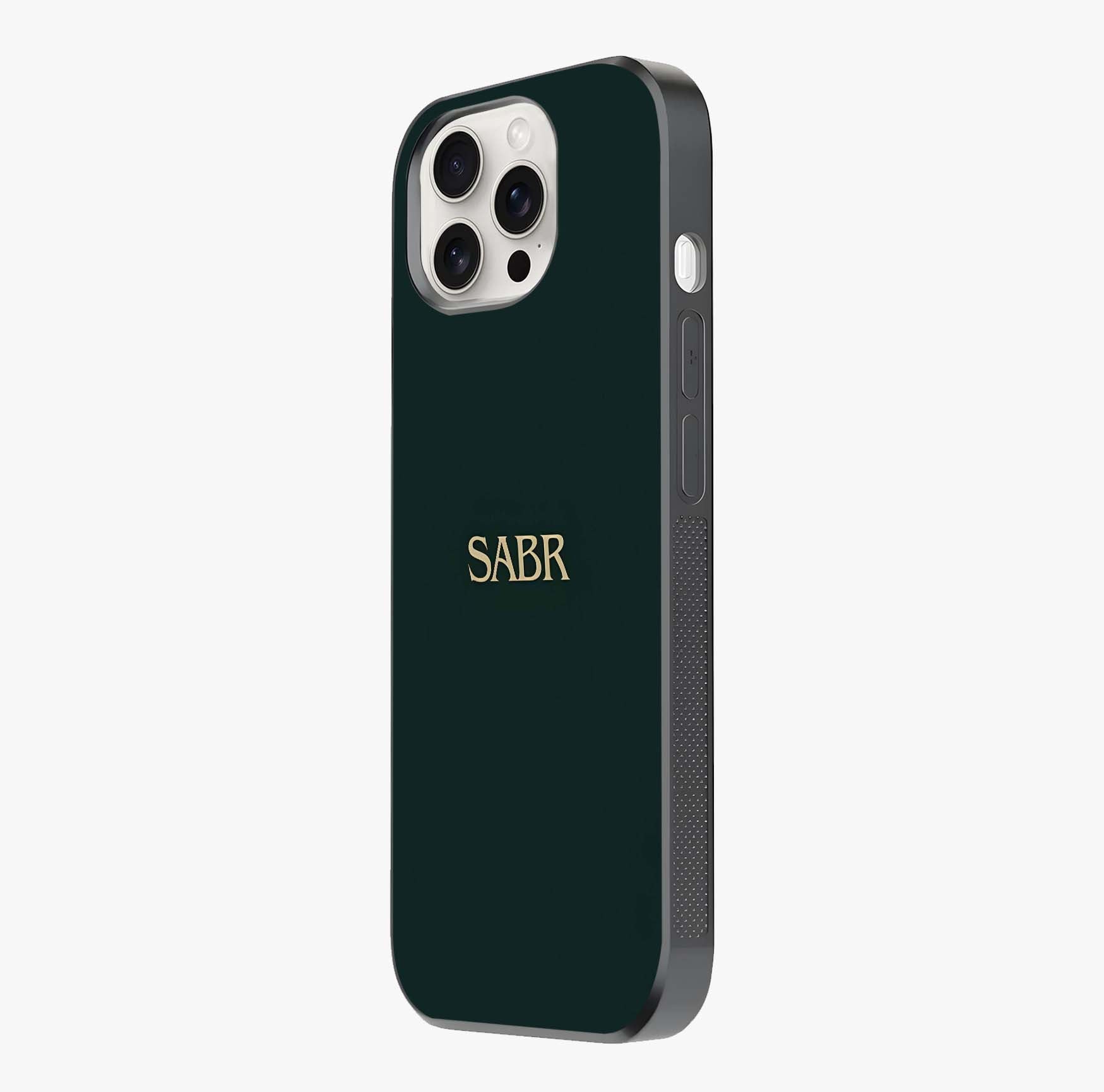 Sabr Minimal Patience Glass Case photographed in natural light showing reflective finish and design depth.