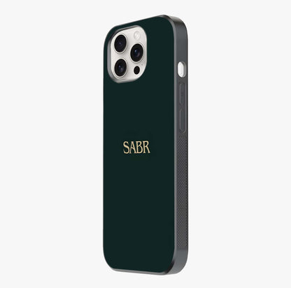 Sabr Minimal Patience Glass Case photographed in natural light showing reflective finish and design depth.