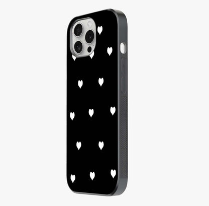 Cute And Simple White Hearts Glass Case photographed in natural light showing reflective finish and design depth.