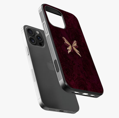 Crimson Fade Butterfly Glass Case laid diagonally highlighting side profile, edges and glossy glass shine.