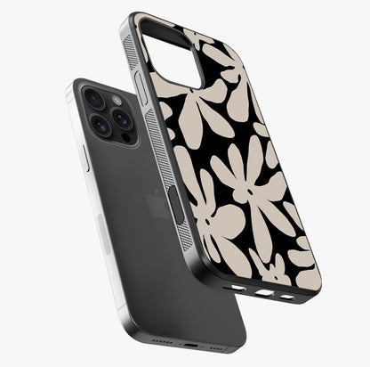 Monochrome Petal Dance Glass Case laid diagonally highlighting side profile, edges and glossy glass shine.