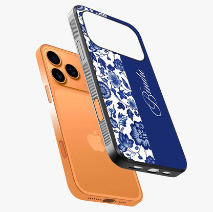 Blue Vintage Floral Pattern Glass Case laid diagonally highlighting side profile, edges and glossy glass shine.