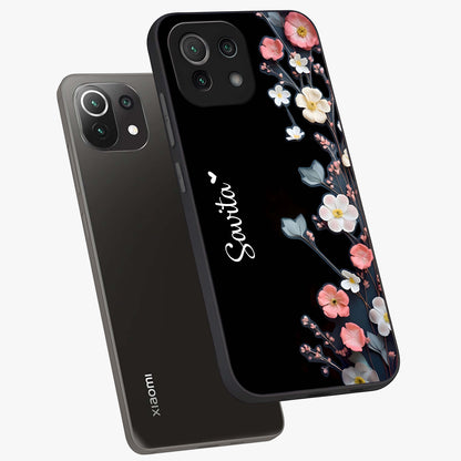 Black Elegance Floral Custom Name Glass Case displayed in angled mockup highlighting dark floral aesthetic and custom name feature.