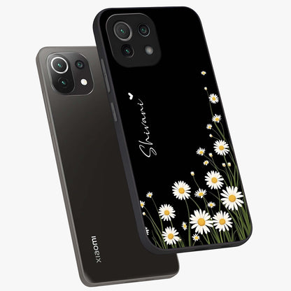 Daisy Cascade Custom Name Glass Case displayed in angled mockup highlighting delicate daisy artwork with custom name feature.