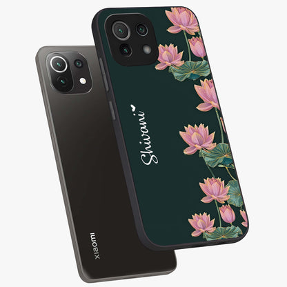 Lotus Bloom Serenity Custom Name Glass Case displayed in angled mockup highlighting graceful lotus illustration with custom name feature.