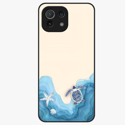 Ocean Drift Turtle Glass Case showing flat back view with sea turtle artwork and glossy glass finish.