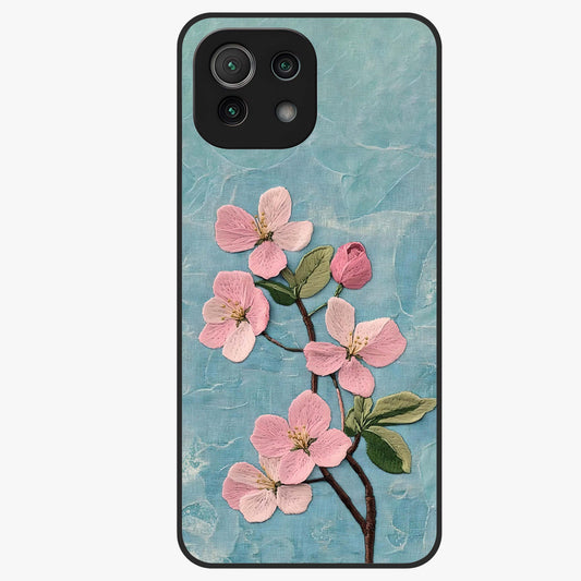 Threaded Blossom Breeze Glass Case showing flat back view with delicate blossom artwork and glossy glass finish.