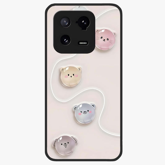 Puffy Face Parade Glass Case showing flat back view with cute puffy character faces artwork and glossy glass finish.
