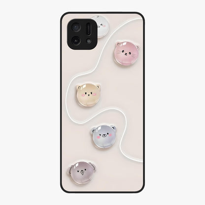 Puffy Face Parade Glass Case showing flat back view with cute puffy character faces artwork and glossy glass finish.