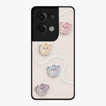 Puffy Face Parade Glass Case showing flat back view with cute puffy character faces artwork and glossy glass finish.