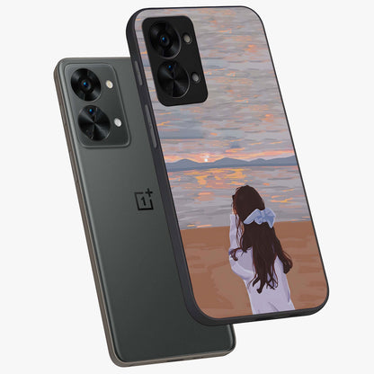 Girl Facing Sunset Beach Glass Case for 1+Nord 2T angled mockup showcasing glossy glass finish and warm beach tones