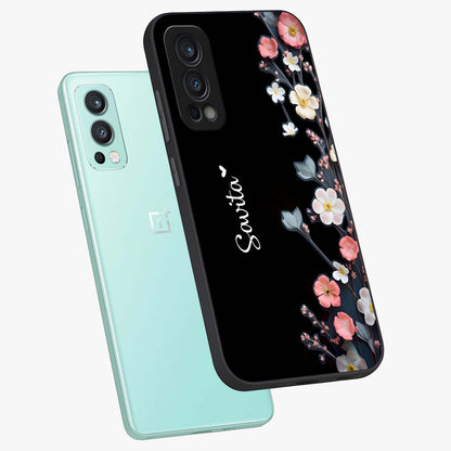 Black Elegance Floral Custom Name Glass Case displayed in angled mockup highlighting dark floral aesthetic and custom name feature.