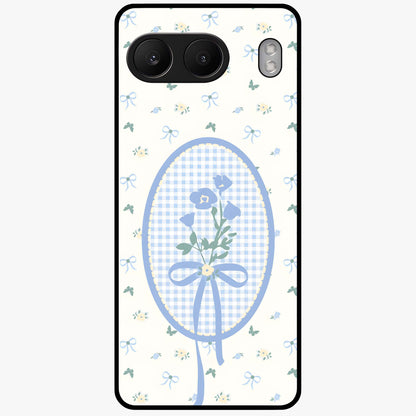 Blue Ribbon Bloom Glass Case for 1+Nord 4 elegant front view featuring soft floral artwork with ribbon accents