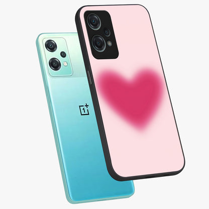 Pink Aura Heart Glass Case for 1+Nord Ce 2 Lite angled mockup showcasing glossy glass finish and radiant aura detailing