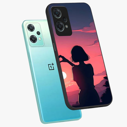 Sunset Silhouette Boy Glass Case for 1+Nord Ce 2 Lite angled mockup showcasing glossy finish and rich orange tones