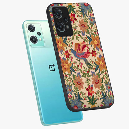 Tropical Folk Art Bird Glass Case for 1+Nord Ce 2 Lite angled mockup showcasing glossy finish and rich cultural tones