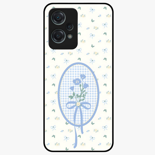Blue Ribbon Bloom Glass Case for 1+Nord Ce 2 Lite elegant front view featuring soft floral artwork with ribbon accents