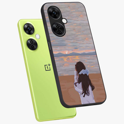 Girl Facing Sunset Beach Glass Case for 1+Nord CE 3 Lite angled mockup showcasing glossy glass finish and warm beach tones