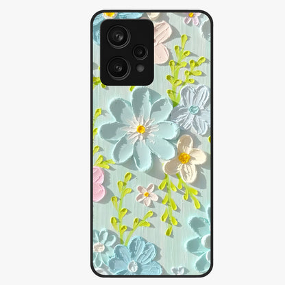 Frosted Petal Garden Glass Case showing flat back view with soft frosted floral artwork and glossy glass finish.