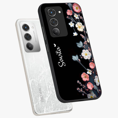 Black Elegance Floral Custom Name Glass Case displayed in angled mockup highlighting dark floral aesthetic and custom name feature.